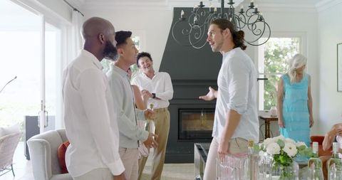 Cheerful Friends Gathering at Wedding Celebration in Bright Living Room