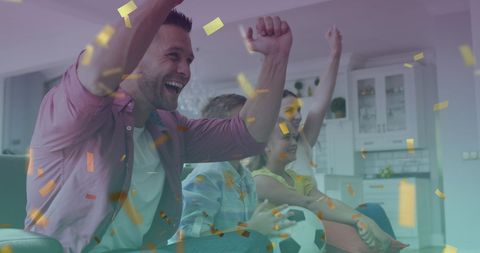 Happy Family Celebrating Victory with Gold Confetti