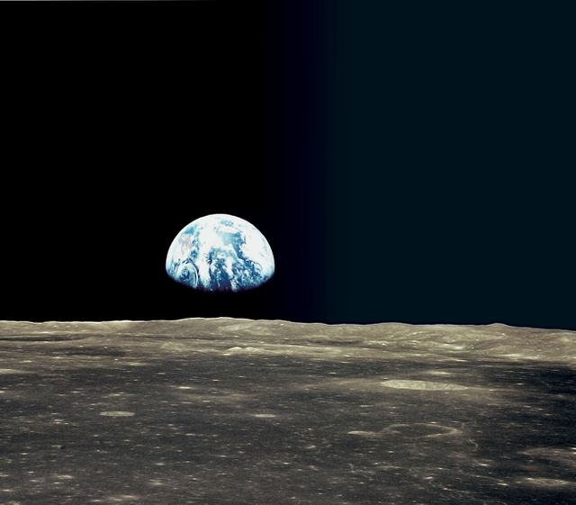 Stunning Earthrise view captured from moon surface featuring detailed lunar craters. Perfect for space exploration, astronomy projects, educational materials, sci-fi illustrations, and promoting environmental awareness.