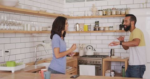 Couple Enjoying Leisure Time in Modern Kitchen