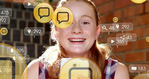 Smiling Young Woman Engaging with Social Media on Smartphone