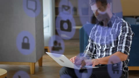 Man Coding on Laptop with Security and Technology Icons Overlay