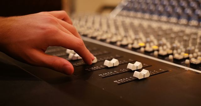 Hand Adjusting Soundboard Mixing Console in Recording Studio - Download Free Stock Images Pikwizard.com