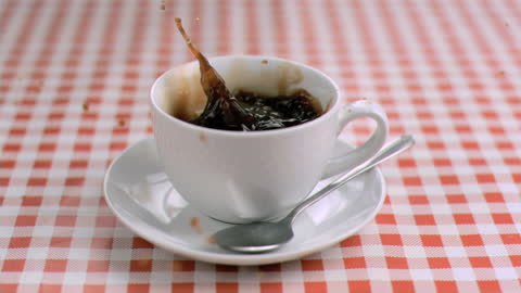 Sugar Cube Creating Splash in Coffee