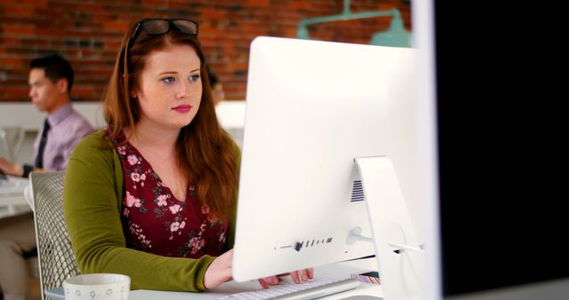 Focused Female Professional Working on Desktop in Modern Office - Download Free Stock Images Pikwizard.com