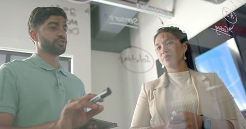 Colleagues Engaging in Interactive Workplace Discussion