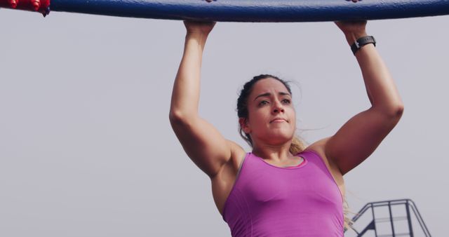 Female Athlete Doing Pull-Ups on Outdoor Fitness Bar - Download Free Stock Images Pikwizard.com