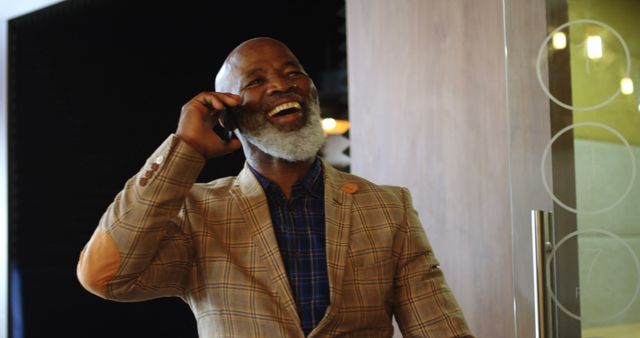 Smiling Senior Man Talking on Smartphone in Modern Office - Download Free Stock Images Pikwizard.com