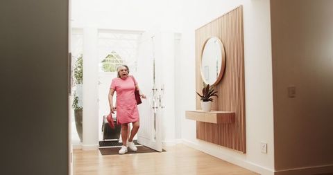 Senior couple arriving at vacation destination with baggage