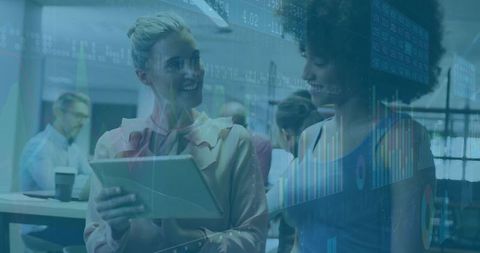 Two professionals collaborating over tablet with financial charts and analytics overlay