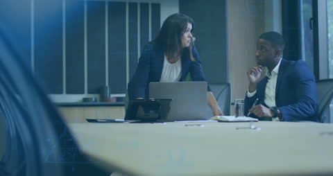 Focused Business Colleagues Discussing Work in Conference Room