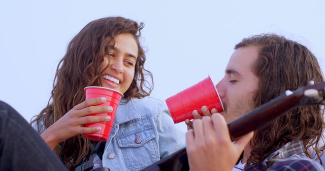 Laughing Friends Drinking Together Outdoors with Red Solo Cups - Download Free Stock Images Pikwizard.com