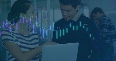 Colleagues Analyzing Datasheet Projections in Modern Office