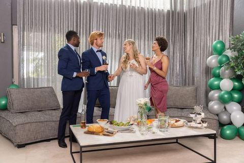 Sophisticated wedding celebration with diverse friends and appetizers