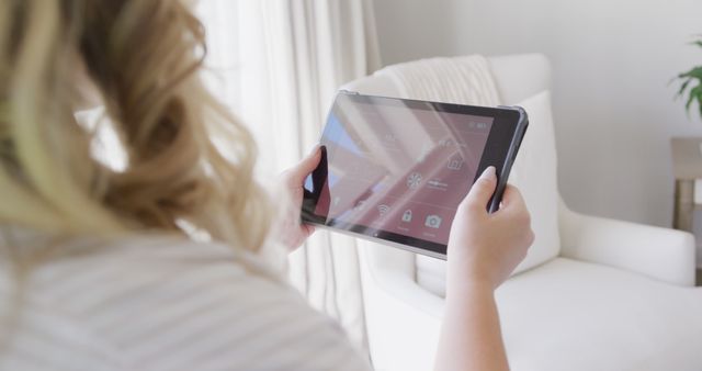 Woman Using Tablet to Control Smart Home Devices - Download Free Stock Images Pikwizard.com