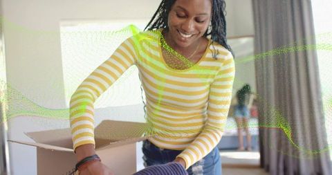 Woman Unpacking at Home Smiling