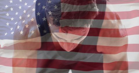 Biracial male athlete with usa flag overlay reflecting sports spirit