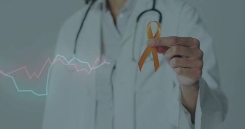 Doctor Holding Orange Awareness Ribbon with Data Graphs in Background