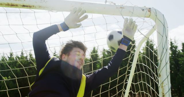 Young Boy Playing as Goalie Saving Goal During Soccer Game - Download Free Stock Images Pikwizard.com