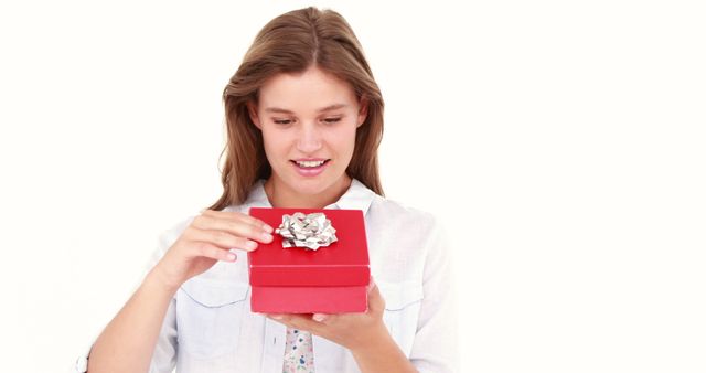 Happy Young Woman Opening Red Gift Box with Silver Bow - Download Free Stock Images Pikwizard.com