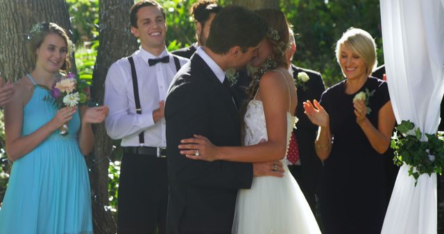 Bride and Groom Sharing First Kiss in Outdoor Wedding Ceremony - Download Free Stock Images Pikwizard.com