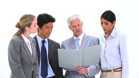 Professional Business Team Analyzing Document Together