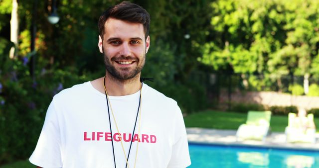 Smiling Male Lifeguard by Outdoor Swimming Pool on Sunny Day - Download Free Stock Images Pikwizard.com