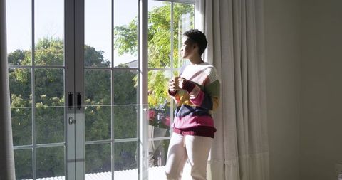 Morning relaxation with lush garden view from sliding glass doors