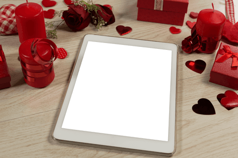 Transparent Tablet Surrounded by Valentine’s Day Decorations