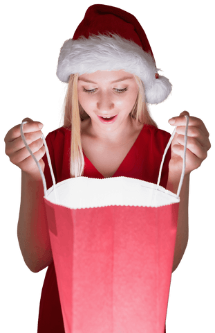 Surprised Woman in Santa Hat Looking into Gift Bag on Transparent Background