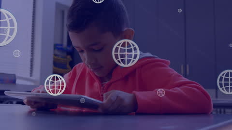 Biracial Boy Engaged with Tablet Amidst Digital Globes in Classroom