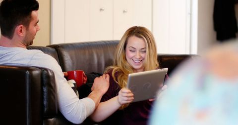 couple relaxing at home with tablet technology - Download Free Stock Images Pikwizard.com