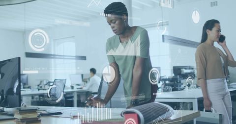 Diverse Business Team Analyzing Data and Charts in Modern Office