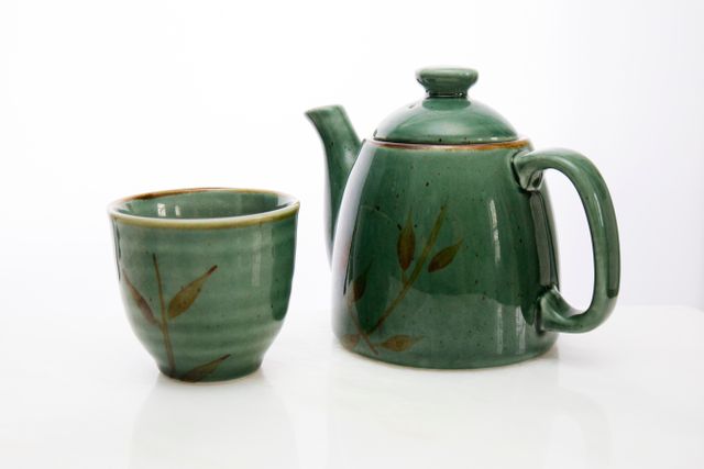 Green Ceramic Teapot and Cup Isolated on White Background - Download Free Stock Photos Pikwizard.com