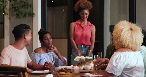 Diverse Friends Celebrating at Casual Dinner Party