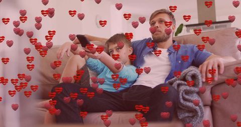 Father and Son Bonding Moment with Digital Heart Icons