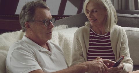 Senior Couple Enjoying Time at Home with Smartphone - Download Free Stock Images Pikwizard.com