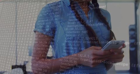 Woman Holding Smartphone with Code Overlay in Modern Office