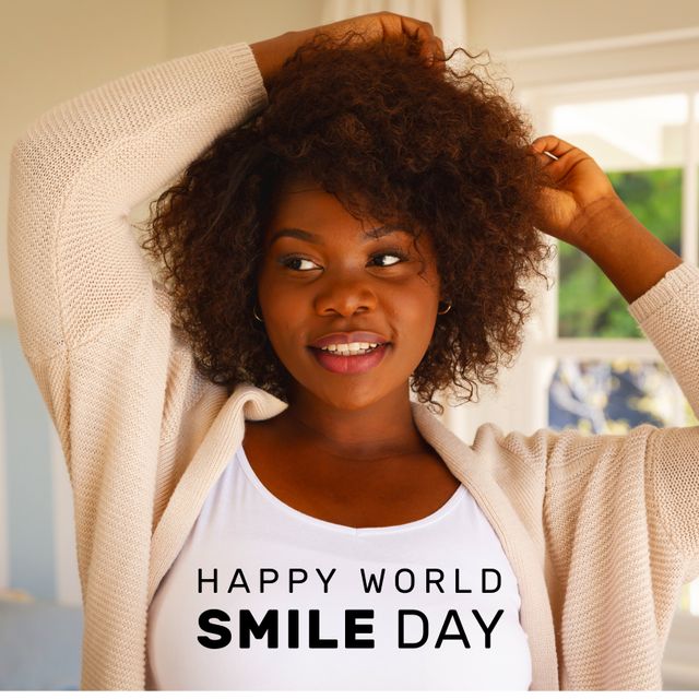 Composition of world smile day text over african american woman smiling. World smile day and celebration concept digitally generated image.