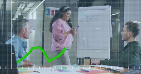 Diverse Team Collaborating with Data Analytics in Modern Office