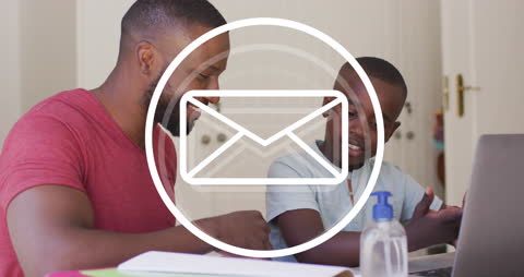 Father and Son Engaging in Online Learning Together with Email Overlay