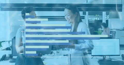 Diverse Female Coworkers Discussing Analytics in Modern Office