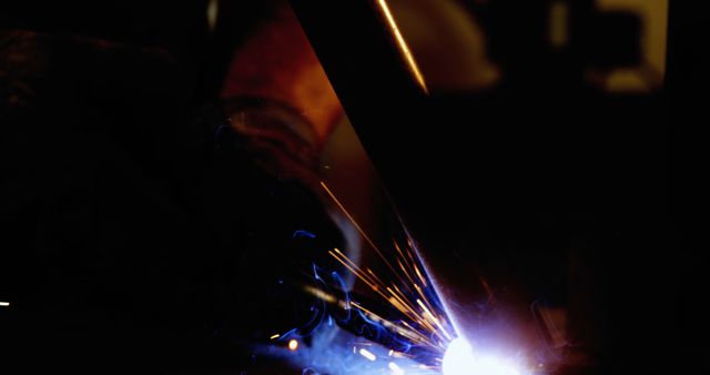 Welder Working With Sparks in Low Light Environment - Download Free Stock Images Pikwizard.com