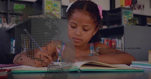 Young girl studying and writing in notebook with classroom focus and dotted digital overlay