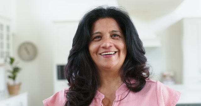 Happy Middle-Aged Woman Smiling in Bright Kitchen - Download Free Stock Images Pikwizard.com