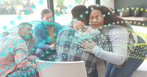 Supportive group hugging in counseling circle with turquoise network overlay