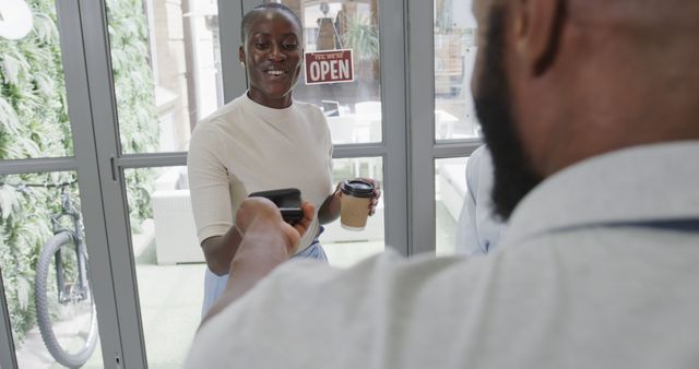 Customer Paying for Coffee Using Mobile Wallet at Cafe Entrance - Download Free Stock Images Pikwizard.com