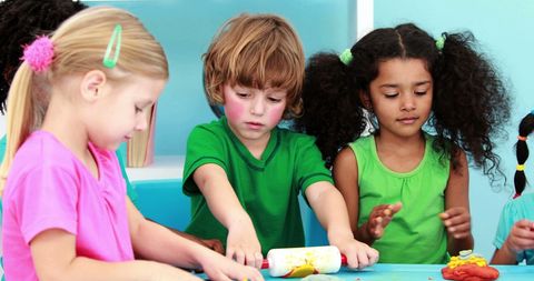 Diverse Preschool Children Engaging with Play Dough at Classroom Table - Download Free Stock Images Pikwizard.com