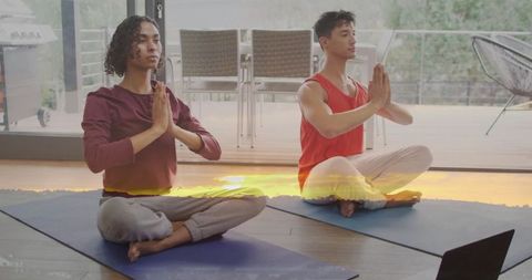 Couple Meditating in Home Yoga Studio during Sunrise