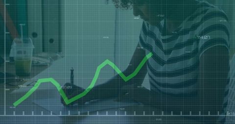 Woman writing while financial growth chart overlay showing rising analytics trend
